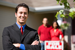 Real estate confident agent with home sellers
