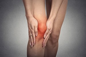Closeup tendon knee joint problems on woman leg