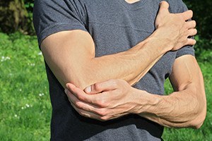 Man with pain in elbow