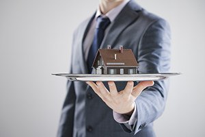 Estate agent agent shaking hands with his customer