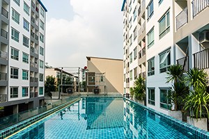 Swimming pool among high rise condo buildings