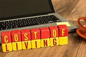 Cost of living written on a wooden cube