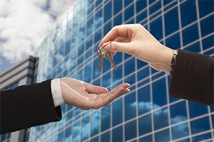 Giving keys in front of building