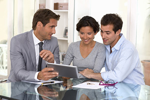 Architect presenting a new project to a young couple