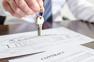 Estate agent holding house keys