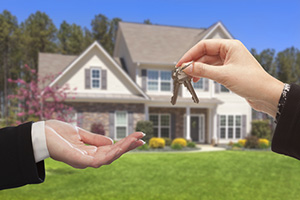 Real Estate Agent Handing Over the House Keys