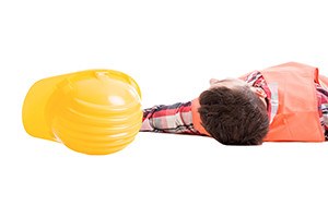 Workplace safety insurance concept with a fainted builder or worker