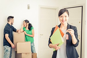 Real estate agent portrait with family getting new home