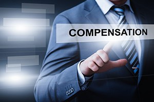 Businessman pressing compensation button on virtual screens