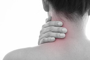 Rear view of a youn women neck muscle pain