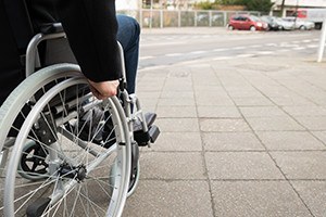 Close up of disabled man sitting on wheelchair