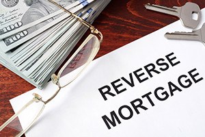 Reverse mortgage form on a table and money