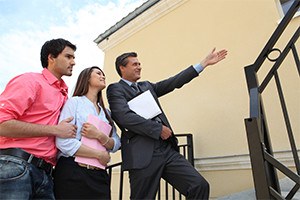 Estate agent with a young couple