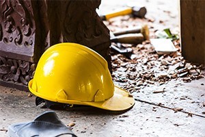 Hard hat on the construction site on the background