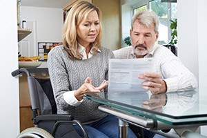 Frustrated couple with woman in wheelchair