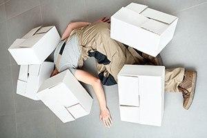 Worker crushed by several heavy cartons