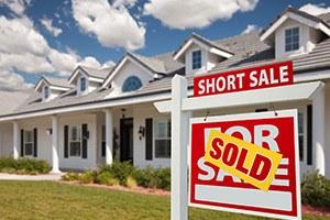 Sold Short Sale Home For Sale Real Estate Sign in Front of New House