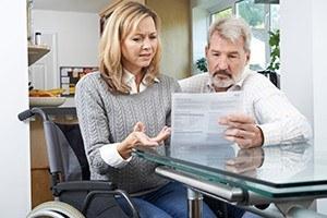 Frustrated couple with woman in wheelchair