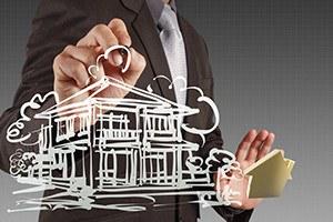 Businessman hand drawing house