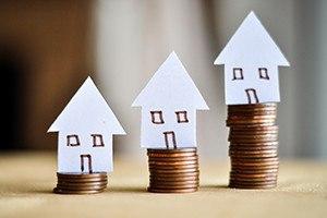 Mortgage concept by money house from the coins